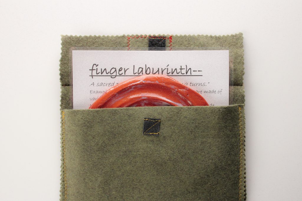The finger labyrinth set includes a 'meaning of labyrinths' and instruction sheet and handmade cloth bag.