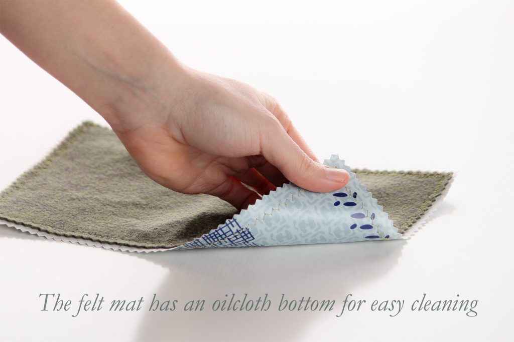 Cloth mat (approx. 10 inches x 7 inches) to set the table for your chalice and paten. The bottom side is "oilcloth" cleanable by wiping with soap and water or sanitizer and the top side is a woolblend felt which is washable.